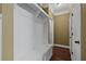 Traditional mudroom featuring built-in white bench and cubbies for storage at 108 Donovan Ave, Locust Grove, GA 30248