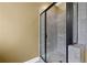 Modern bathroom shower featuring sleek black frame and neutral colored tiling at 108 Donovan Ave, Locust Grove, GA 30248