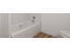 Clean white bathtub and shower combination with chrome fixtures in a well-lit bathroom at 172 White Rose Ln, Temple, GA 30179