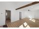 Spacious living room featuring hardwood floors, wooden beam and neutral walls at 172 White Rose Ln, Temple, GA 30179
