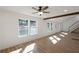 Bright living room featuring hardwood floors, wooden beam, neutral walls, and multiple windows at 172 White Rose Ln, Temple, GA 30179