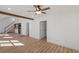 Spacious living room featuring hardwood floors, wooden beam, and an open concept design at 172 White Rose Ln, Temple, GA 30179