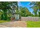A spacious backyard with a beautiful fence, green grass, and direct access to the house at 2200 Glendale Dr, Atlanta, GA 30032