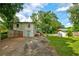 This backyard features a shed and the back of the house with an outdoor deck at 2200 Glendale Dr, Atlanta, GA 30032