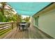 Backyard view shows deck with blue awning, grill, and seating area, perfect for outdoor entertaining at 2200 Glendale Dr, Atlanta, GA 30032