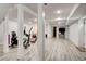 Finished basement featuring light wood-look flooring, recessed lighting, and fitness/entertainment areas at 2200 Glendale Dr, Atlanta, GA 30032