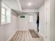Finished basement area with an exterior door and storage space at 2200 Glendale Dr, Atlanta, GA 30032
