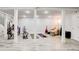Spacious basement with light gray floors, white columns, rec lighting, and a workout area at 2200 Glendale Dr, Atlanta, GA 30032