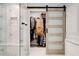 Well-organized walk-in closet off the bathroom with a sliding barn door and built-in storage at 2200 Glendale Dr, Atlanta, GA 30032