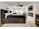 Comfortable bedroom with a paneled accent wall, fireplace, and television at 2200 Glendale Dr, Atlanta, GA 30032