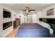Cozy bedroom showcasing a fireplace, mounted TV, and sliding barn door closet at 2200 Glendale Dr, Atlanta, GA 30032