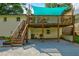 Outdoor wooden deck covered with a green shade cover that is directly attached to the house at 2200 Glendale Dr, Atlanta, GA 30032