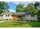 Charming home with well-manicured front yard, and unique exterior design elements at 2200 Glendale Dr, Atlanta, GA 30032