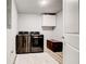 Modern laundry room with stainless steel washer and dryer at 2200 Glendale Dr, Atlanta, GA 30032