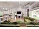 Open concept living space featuring a modern kitchen and inviting green sectional sofa at 2200 Glendale Dr, Atlanta, GA 30032