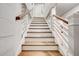 Bright and airy staircase with white railings and wooden steps at 2200 Glendale Dr, Atlanta, GA 30032