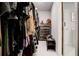 Spacious walk-in closet with ample hanging space, shelving, and a view into the bathroom at 2200 Glendale Dr, Atlanta, GA 30032
