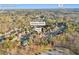 Aerial view showcases the Buford, GA home near Hamilton Mill Rd. and I-85 with lush trees at 4055 Inman Park Ln, Buford, GA 30519