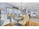 Charming dining room features stylish furniture, a modern chandelier, and is open to the living room at 4055 Inman Park Ln, Buford, GA 30519