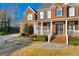 Lovely brick home featuring a covered porch and landscaped yard at 4055 Inman Park Ln, Buford, GA 30519