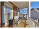 Comfortable front porch with white wicker seating and classic brick accents at 4055 Inman Park Ln, Buford, GA 30519