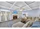 Cozy living room features coffered ceilings, fireplace, and French doors to the outside at 4055 Inman Park Ln, Buford, GA 30519
