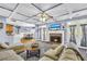 Open-concept living room features coffered ceilings, fireplace, and access to dining and kitchen at 4055 Inman Park Ln, Buford, GA 30519