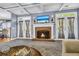 Cozy living room with fireplace, carpet, and French doors to the outside at 4055 Inman Park Ln, Buford, GA 30519