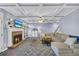 Living room with fireplace, ceiling fan, and staircase to the second floor at 4055 Inman Park Ln, Buford, GA 30519
