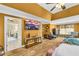 Main bedroom with hardwood floors, ceiling fan, and a wall-mounted television at 4055 Inman Park Ln, Buford, GA 30519