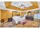 Main bedroom with hardwood floors, ceiling fan, and decorative furniture at 4055 Inman Park Ln, Buford, GA 30519