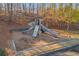 Community playground with slides and climbing equipment surrounded by trees at 4055 Inman Park Ln, Buford, GA 30519