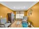 Sitting room featuring hardwood floors, decorative windows, and vintage chairs at 4055 Inman Park Ln, Buford, GA 30519