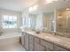 Spacious bathroom with double vanity and soaking tub at 525 Paces Dr, Lithia Springs, GA 30122
