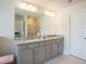 Bathroom featuring double vanity and glass shower at 525 Paces Dr, Lithia Springs, GA 30122