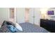 This bedroom has a comfortable bed, decorative pillows, and access to a bathroom and the rest of the home at 525 Paces Dr, Lithia Springs, GA 30122