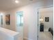 Upstairs hallway with neutral colors, art, and bedroom views at 525 Paces Dr, Lithia Springs, GA 30122