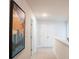 Upstairs hallway with neutral colors, art, and doors leading to other rooms at 525 Paces Dr, Lithia Springs, GA 30122