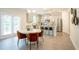 Modern eat-in kitchen featuring gray cabinets, stainless appliances, and a door to the deck at 525 Paces Dr, Lithia Springs, GA 30122