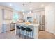 Modern kitchen featuring gray cabinets, stainless steel appliances, and a breakfast bar at 525 Paces Dr, Lithia Springs, GA 30122