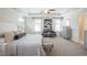 Spacious main bedroom boasts a ceiling fan, sitting area, tray ceiling, natural light, and neutral color scheme at 525 Paces Dr, Lithia Springs, GA 30122