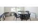 Conference room includes a round table, six chairs, and tile and carpet samples to choose from at 525 Paces Dr, Lithia Springs, GA 30122