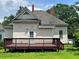 Backyard of a house showcasing a wooden deck overlooking a grassy lawn at 3155 E East Point E St, East Point, GA 30344