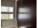 Bedroom with hardwood floors, a door, and two large windows for plenty of light at 3155 E East Point E St, East Point, GA 30344