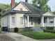 Charming single-Gathering home with covered front porch, mature trees and landscaping at 3155 E East Point E St, East Point, GA 30344