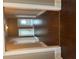 Bright hallway featuring hardwood floors and white trim on the upper and lower trim at 3155 E East Point E St, East Point, GA 30344