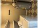 Laundry room features a washer and dryer, a water heater, and shelving for organization at 3155 E East Point E St, East Point, GA 30344