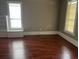 Spacious living room with hardwood floors, neutral walls, and natural light at 3155 E East Point E St, East Point, GA 30344