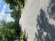 View of a tree-lined street with houses, powerlines, and a car driving in the distance at 3155 E East Point E St, East Point, GA 30344