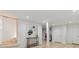 Basement view featuring light walls, light wood flooring, console table and full bath at 1505 Ezra Church Nw Dr, Atlanta, GA 30314